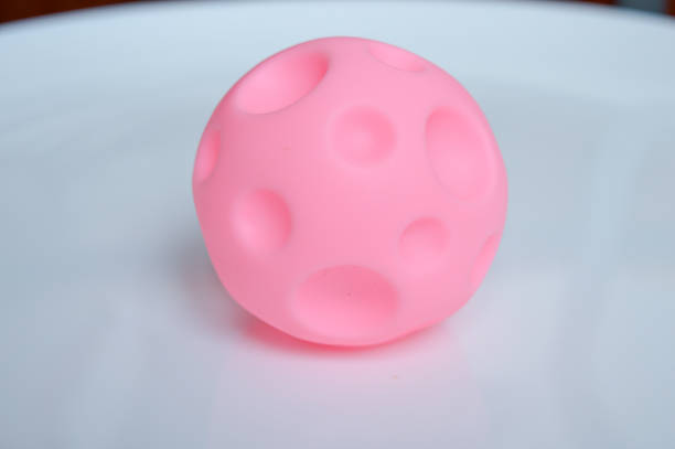 istock hand holding sensory textured ball babies toddlers tactile stimulation sensory play early childhood development toys autism-friendly motor skills improvement special education non-digital Montessori 2200804092