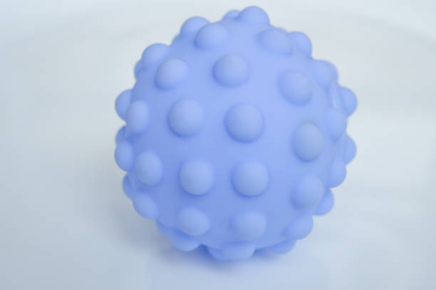 istock hand holding sensory textured ball babies toddlers tactile stimulation sensory play early childhood development toys autism-friendly motor skills improvement special education non-digital Montessori 2200804298
