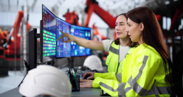 istock Female engineer developing automated manufacturing system at modern factory 2200808192