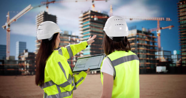 istock Female Construction Engineer Inspecting Site with Tablet and Clipboard, Worker 2200808259