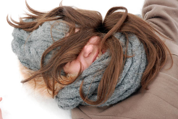 Cozy winter serenity with warm knitted scarves and snow.