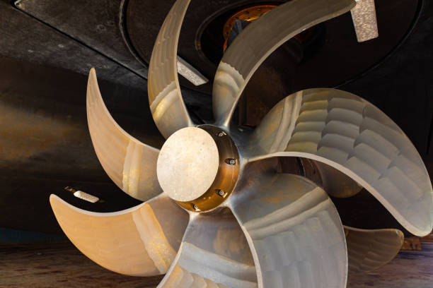 istock New ship's seven blade bronze propeller, close-up. 2200814323