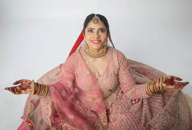 istock High angle view beautiful bride dressed in pink traditional wedding dress 2200816998