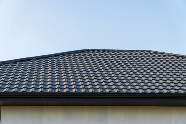 istock The rooftop displays expertly arranged tiles, reflecting sunlight in a serene suburban setting, creating a harmonious blend with the sky 2200817163