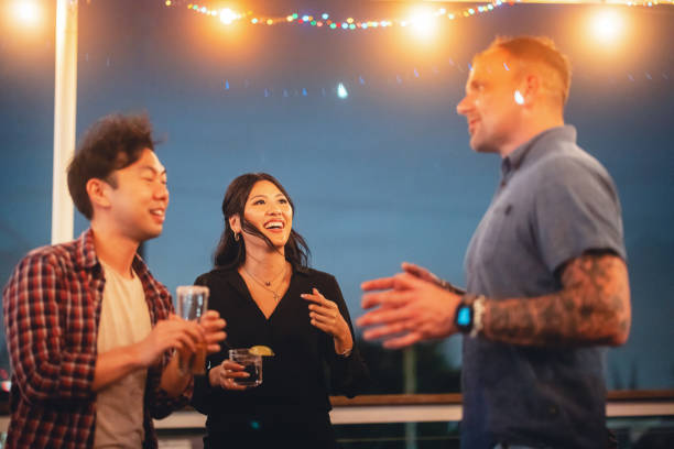 istock Joyful Diverse Friends Enjoying Rooftop Party 2200821516