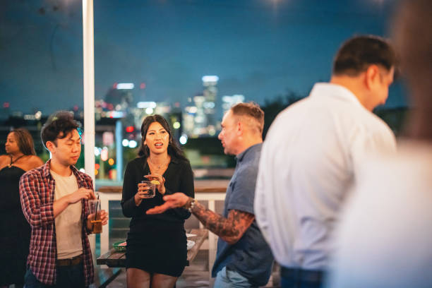 istock Diverse Friends Enjoying Rooftop Party at Night 2200821532