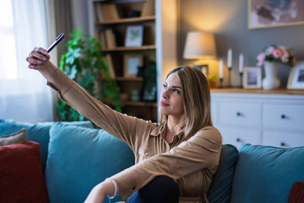 istock Young Woman working on smart phone 2200821960