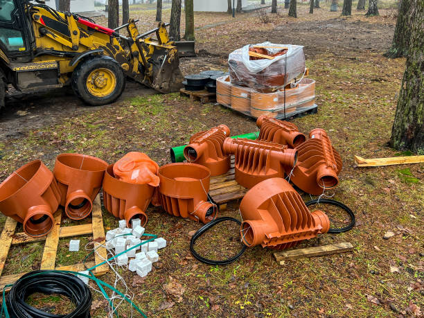 istock Various elements, mainly plastic, prepared for the construction of the sewage network and the connections of buildings to this network. 2200822135