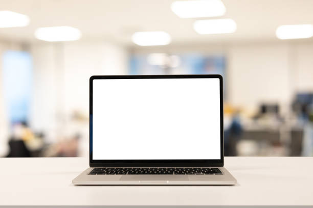 close up isolated on blank white screen display of laptop computer on table inside office room for add content of design banner , website or template or online shopping e-commerce concept