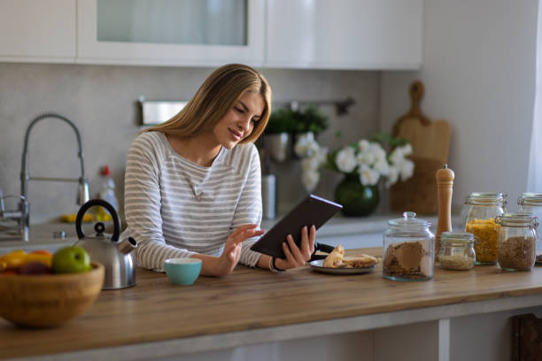 istock Morning activities in pyjamas with phone and laptop 2200828537