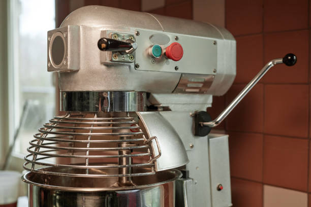 Close up on professional dough kneading machine in commercial kitchen, copy space