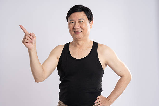 istock portrait of elderly man exercising on white background 2200830857