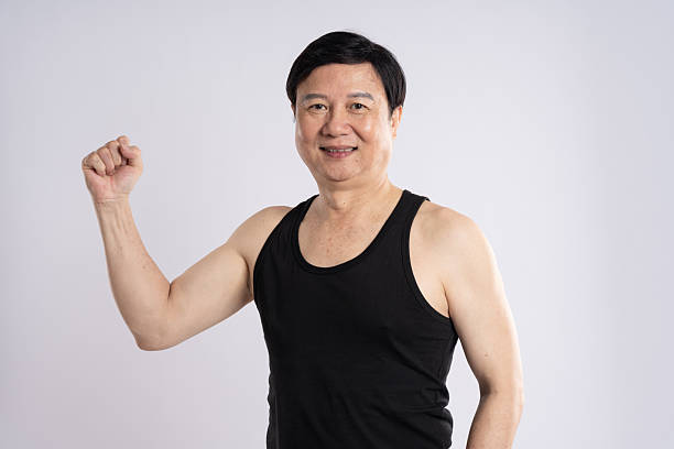 istock portrait of elderly man exercising on white background 2200830873