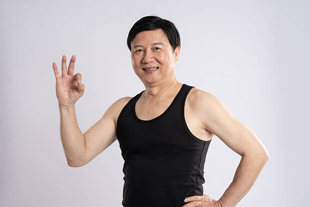 istock portrait of elderly man exercising on white background 2200830876