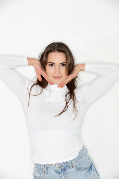 istock Beautiful brunette posing against white background 2200830966