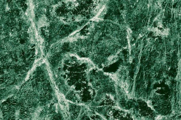 istock Real closeup of dark green marble stone texture surface background. Design pattern with high resolution for luxury home decoration. Abstract matt slab rock material. Front view of natural tiles stone surface. 2200833167