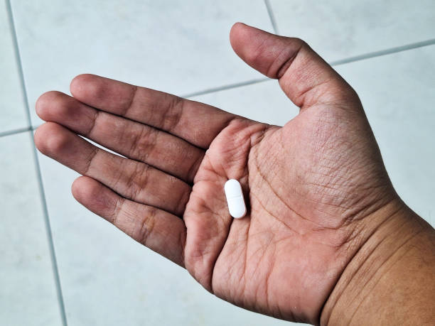 istock A tablet medicine in hand. 2200833750