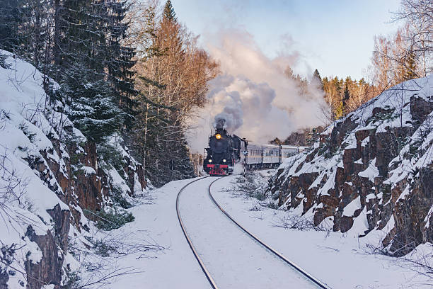 istock Retro train moves at winter morning. 2200836085