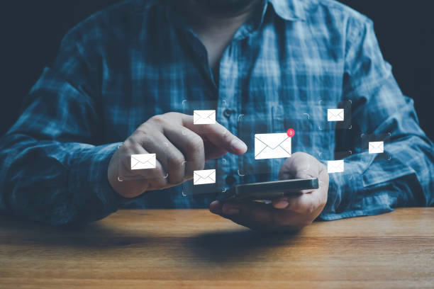 istock Email marketing concept, Human touch on email and surfing the internet with email icon, email icon, e-mail communication, e-mail marketing concept, send e-mail or news letter, online working internet. 2200837635