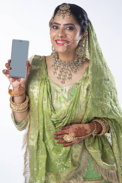 istock Bride showing mobile phone on white background 2200838107