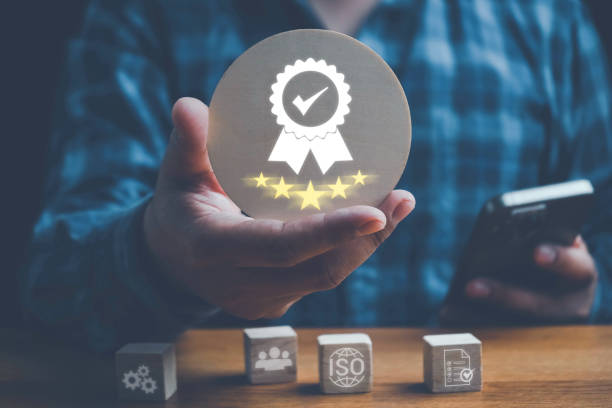 istock ISO standards quality control, assurance and warranty business technology concept. Touching on screen with ISO and globe icons on smart background. ISO Standard certification. Modern ISO banner. 2200839329