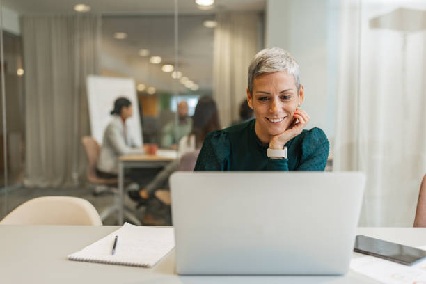 istock Smiling Woman During Online Conference Call 2200839929