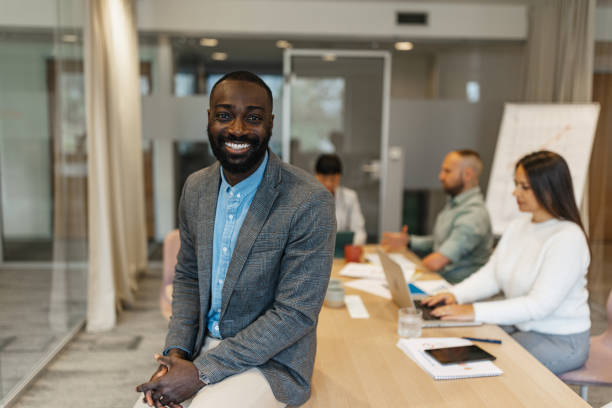 istock Smiling Businessman at a Collaborative Meeting 2200841541