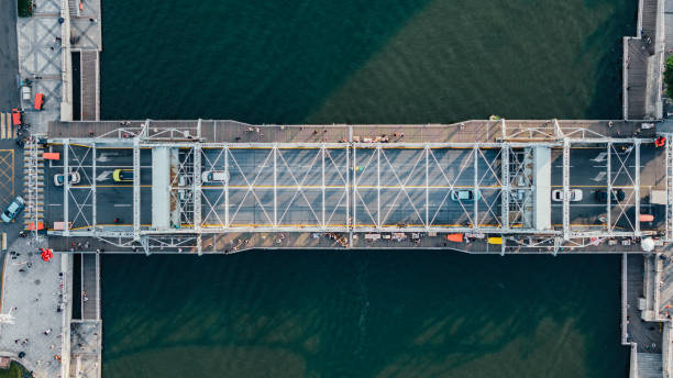 istock Aerial View of Road Bridge across River 2200843878