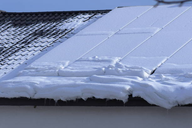 istock Snow-covered solar panels on the roof 2200847639