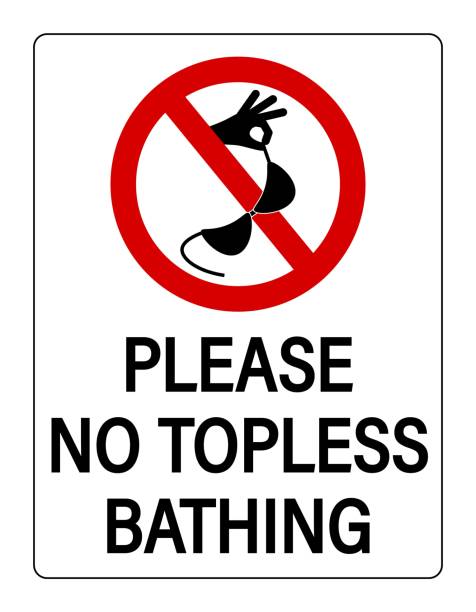 Please, no topless bathing. Ban sign with symbol and text. Please, no topless bathing. Ban sign with hand holding a bikini bra. Text below. dress-code-violation stock illustrations