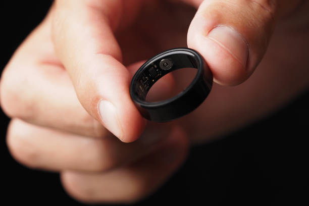 istock Hand Holding Smart Ring, Heart Rate, Blood Oxygen Tracker. 2200848482