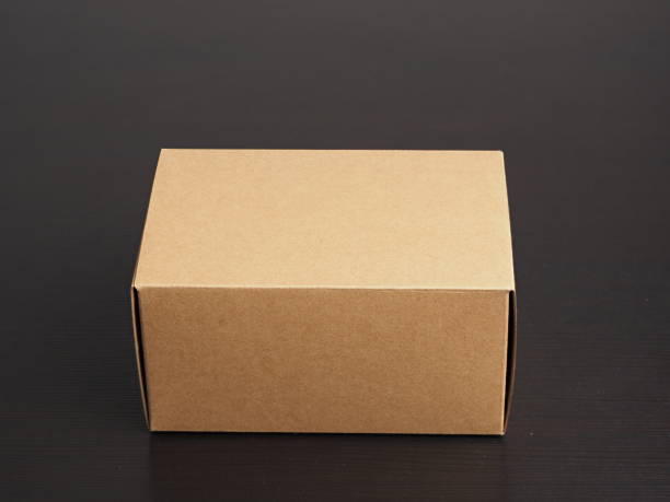 istock Cardboard box for storage or packaging purposes on desk. 2200848488