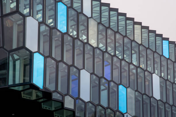 Reykjavik, Iceland - 6 October 2021: The Harpa Concert Hall and Conference Centre in Reykjavik old harbour. Detail of the exterior glass and steel facade. Abstract design background.