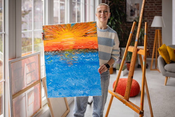 istock Creative young artist joyfully painting in a cozy home studio during a relaxing weekend afternoon 2200849465