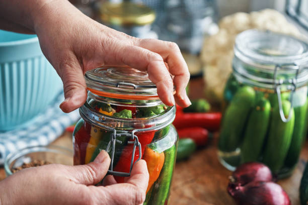Fermented Foods - Preparing Fermented Mixed Chili Peppers and Filled in a Jar