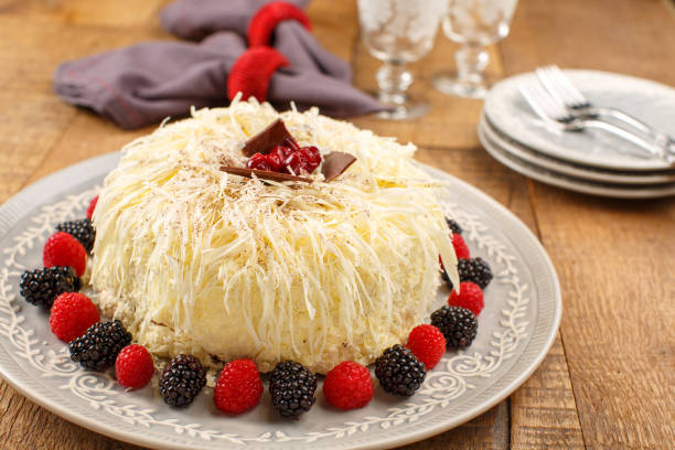 istock Whole Cake with Grated White Chocolate, Garnished with Fresh Berries 2200851992