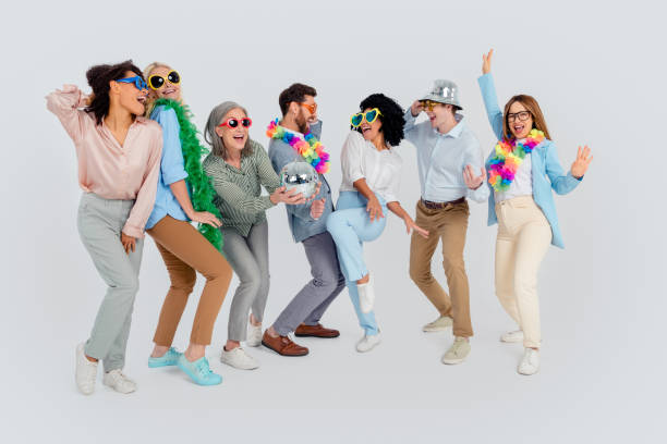 istock Group of diverse coworkers enjoying fun and creative teamwork with a gray background, multi-age 2200853452