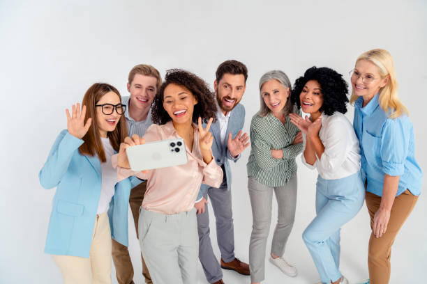 istock Group of professional colleagues taking a selfie together for work collaboration inspiration 2200853737