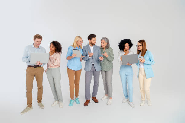 istock Group of diverse professionals working together on grey background, teamwork for collaboration 2200853738