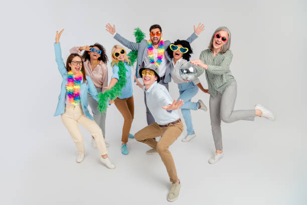 istock Diverse Team Celebrating Joyfully with Colorful Props on a Grey Background in a Friendly Office Setting 2200853742