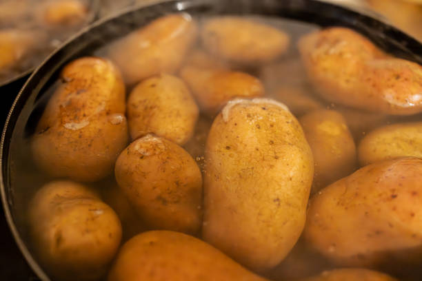 istock Steaming Pot of Boiling Potatoes in a Kitchen 2200854113