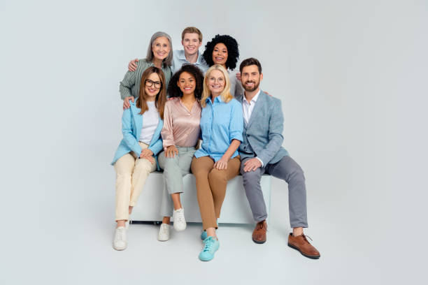 istock Group of diverse professionals posing together in a friendly environment on a neutral background 2200854261
