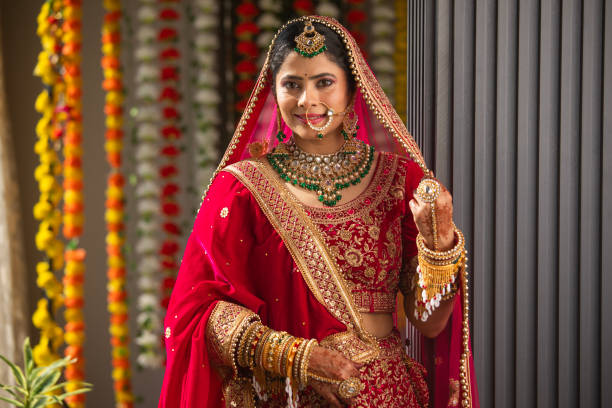 istock Happy bride wearing red dupatta in wedding ceremony 2200856829