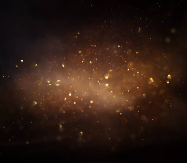 istock background of abstract glitter lights. gold and black. de focused 2200857555