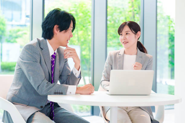 istock Female employee consulting with her supervisor 2200859146