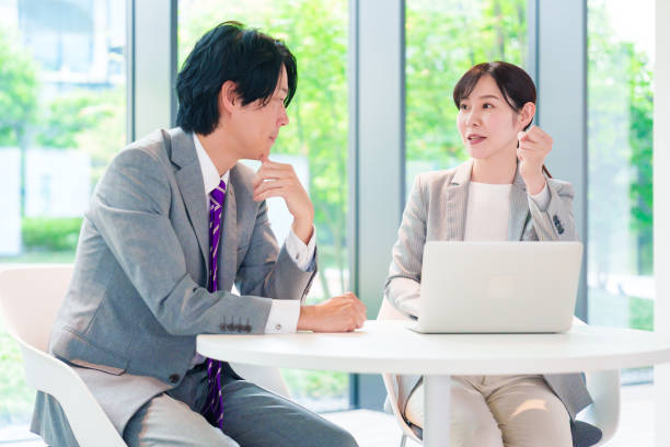 istock Female employee consulting with her supervisor 2200859150