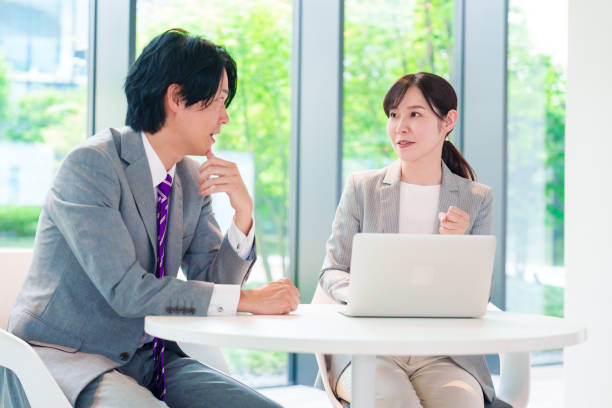 istock Female employee consulting with her supervisor 2200859154