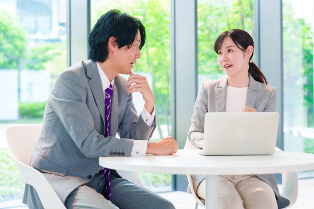 istock Female employee consulting with her supervisor 2200859155