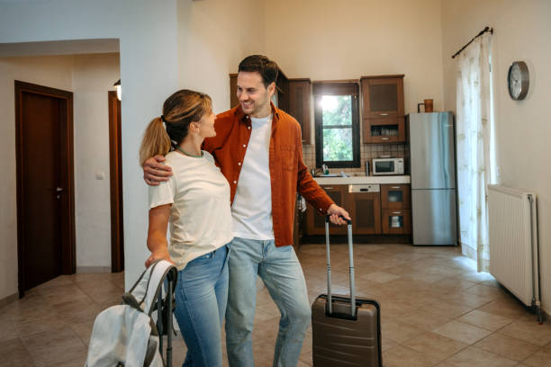 istock Young couple arriving at a hotel room 2200859865