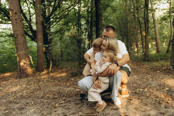 istock Happy Family Enjoying Quality Time Together in a Sunny Forest Setting 2200859974